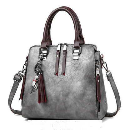 Sac à main chic femme en cuir avec bretelle moderne
