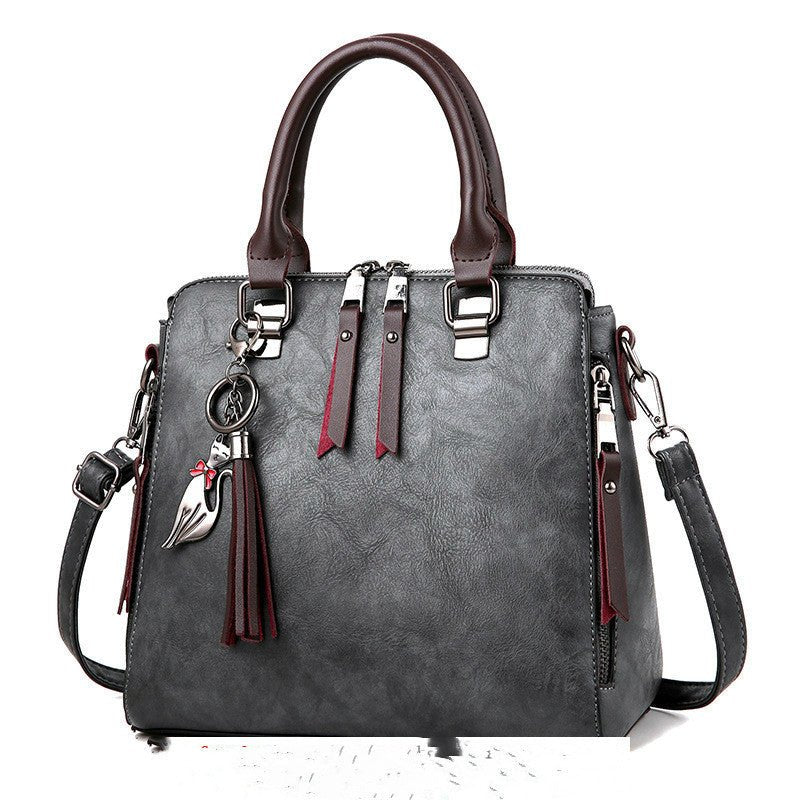 Sac à main chic femme en cuir avec bretelle moderne